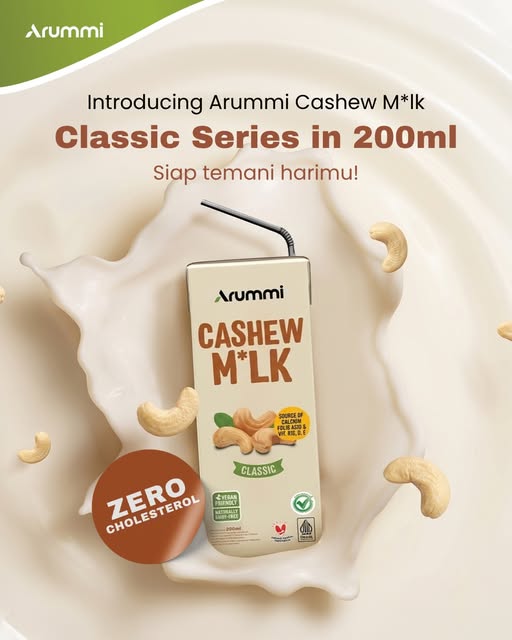 Arummi Classic carton, cream with a green Classic label, on a splash of milk with cashews.